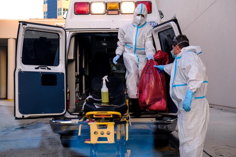 EMT’s cleanse their materials outside Memorial West Hospital where coronavirus are treated, in Pembroke Pines, Florida. REUTERS/Maria Alejandra Cardona    